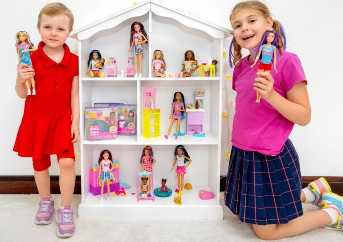 Young creators with a Barbie dolls playhouse